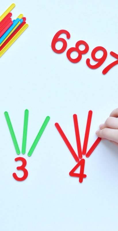 The child learns Number line and geometric shapes. The preschooler works with Montessori material. Educational logic toys for kid's. Children's hands close-up. Montessori Games for Child Development.
