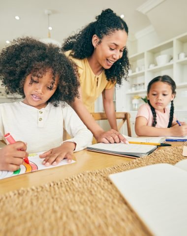 Writing, learning and children with mother for home education and support, creativity and color guide. African kids, family and mom talking, teaching and helping with school drawing for development.